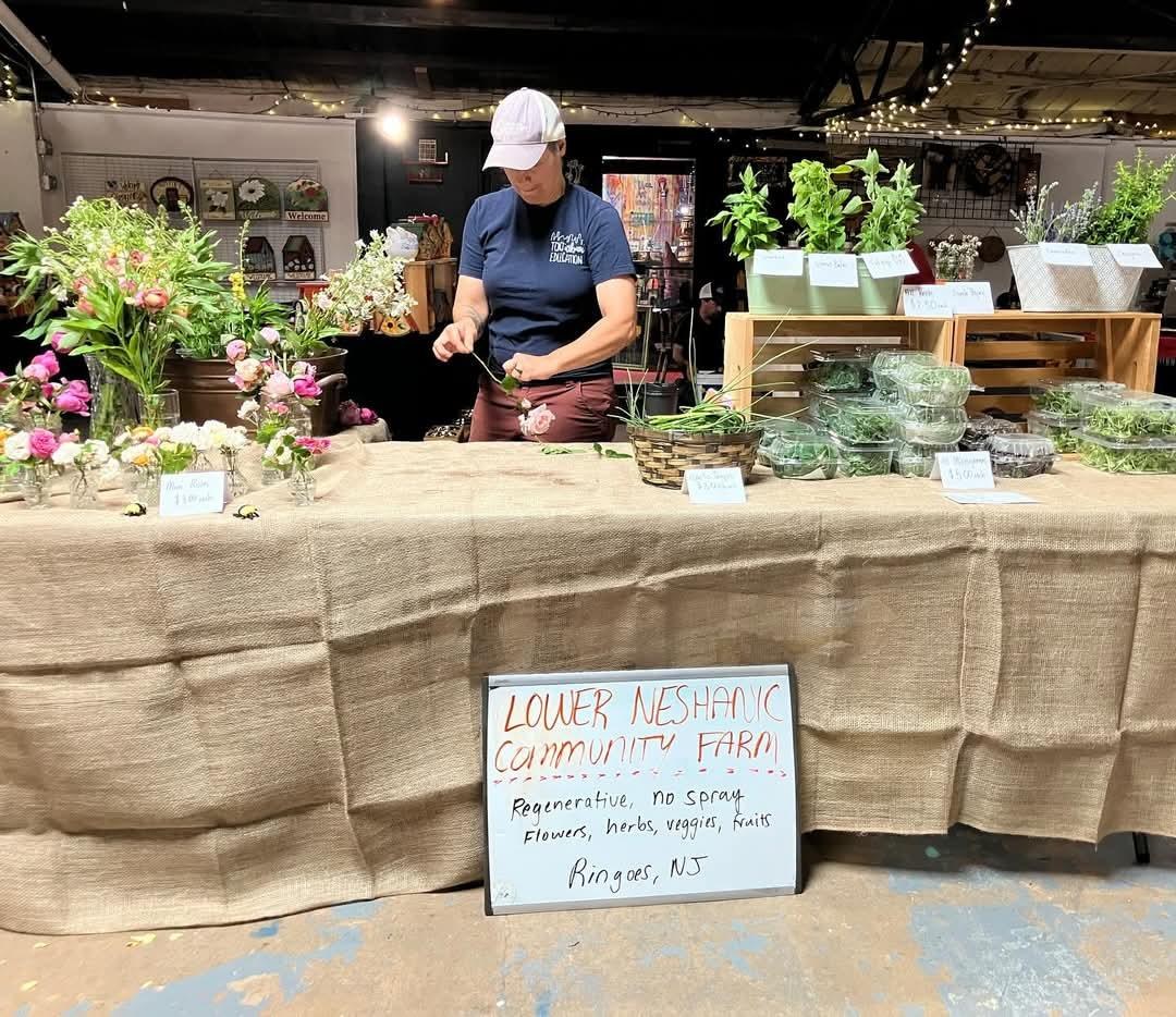 Plants and flowers on a vendor’s table inside Stangl Factory