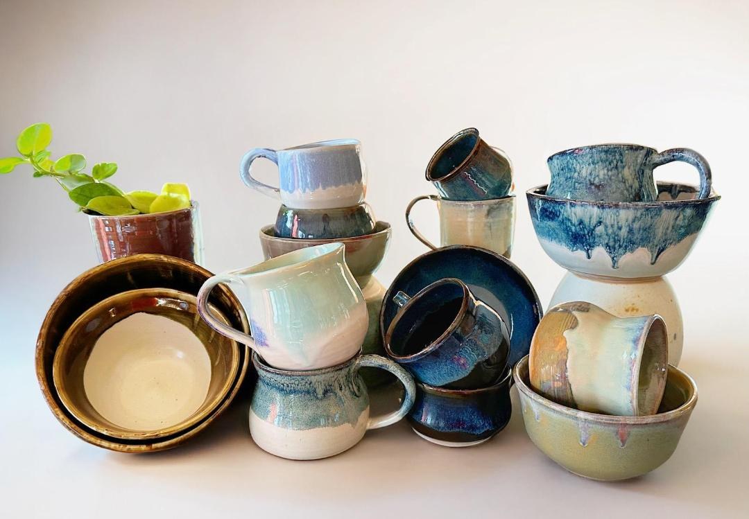 Glazed mugs and bowls pictured in a Stangl market newsletter. Maker and patterns unconfirmed; not identified as vintage Stangl.